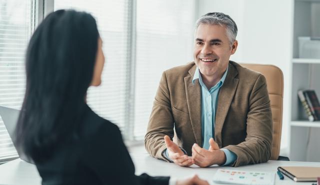 Professional talking at desk