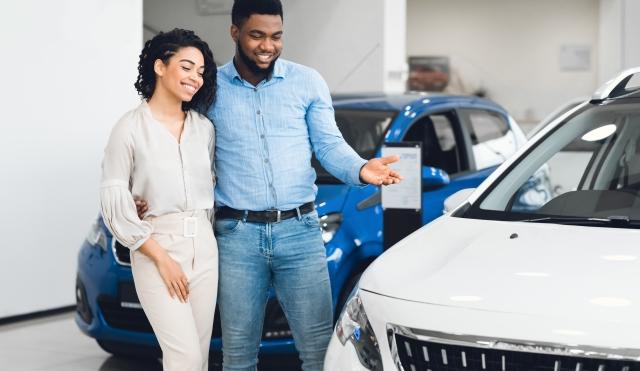 Couple looking at car