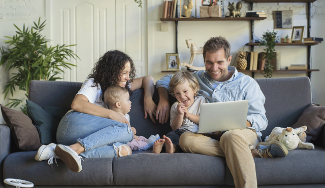 Family on couch with kids