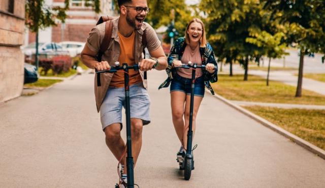 young adults on scooters