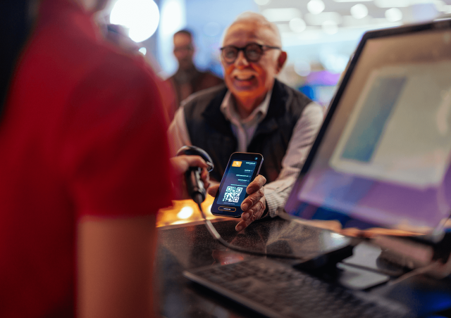 Man scanning a digital ticket at an event